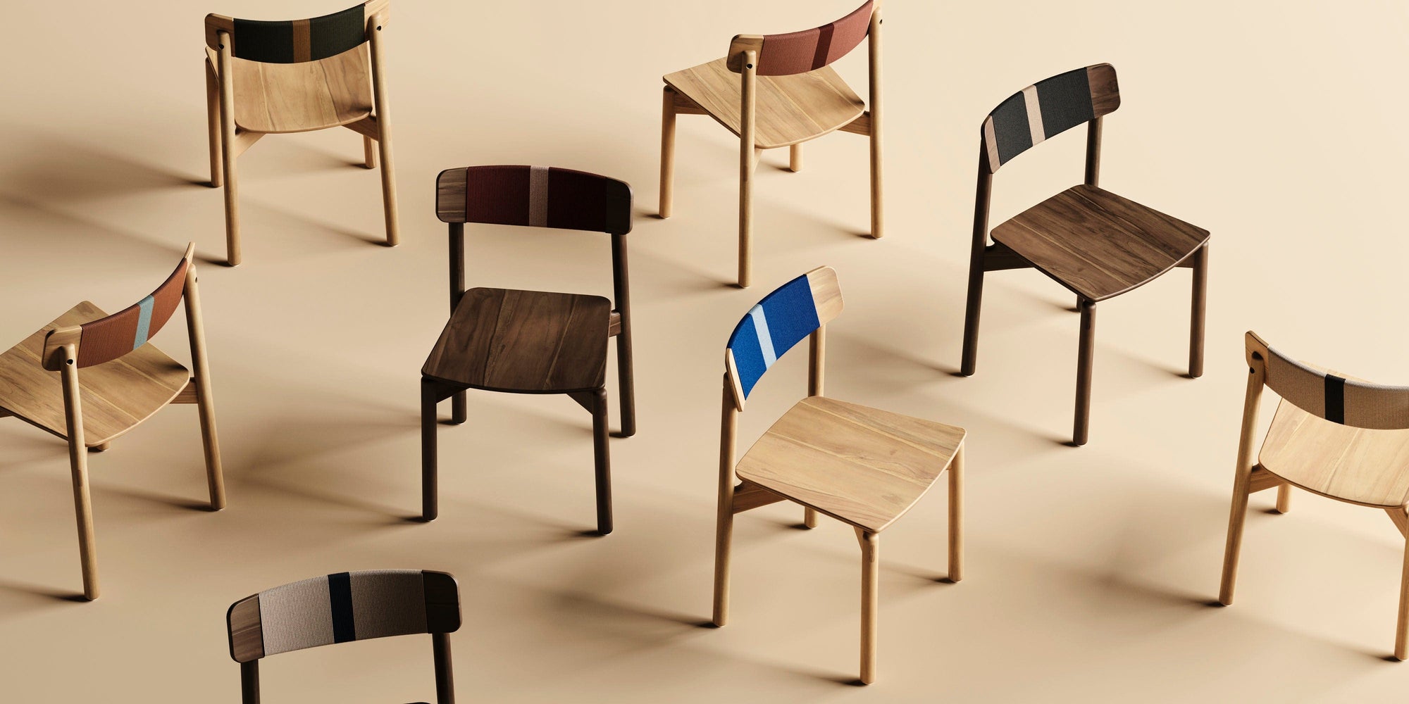 Set of wooden chairs with striped backs on a beige background