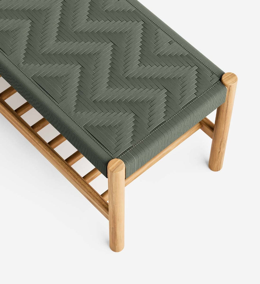 A modern bench with a natural wood frame and a dark olive green woven rope seat featuring a chevron pattern, shown on a clean white background.