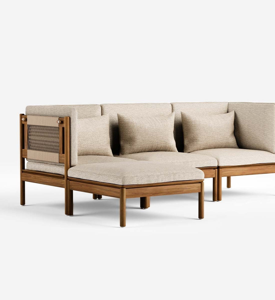 Beige outdoor sofa with wooden frame and wicker accents on a white background