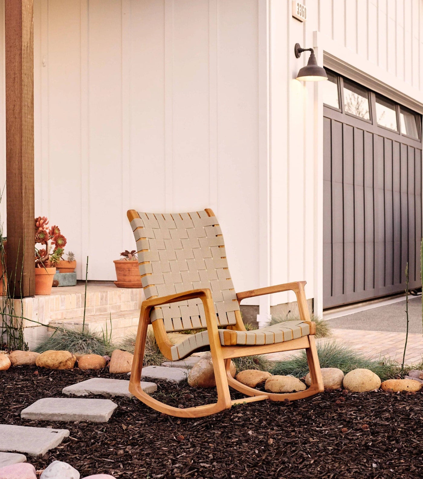 The Arenal Outdoor Rocking chair comes in two colors of durable outdoor webbed strap.