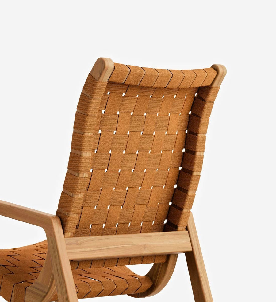 Close-up of a wooden chair with woven tan straps on a light gray background.