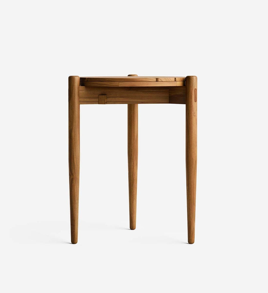 A mid-century modern wooden side table with tapered legs and a folded-down top, shown from the back on a light gray background.