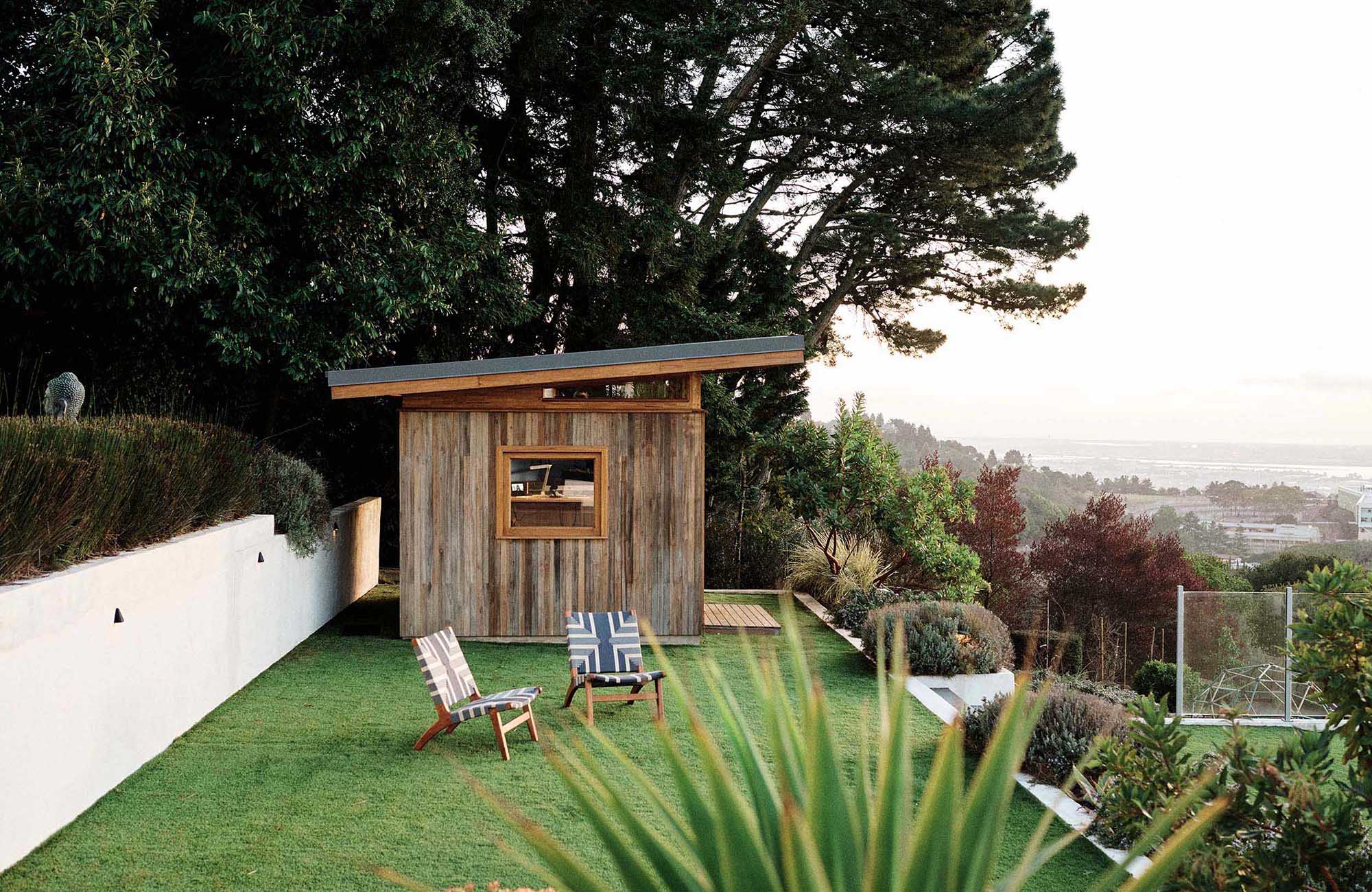 Outdoor Teak ADU by Masaya Homes in a yard with outdoor teak woven chairs